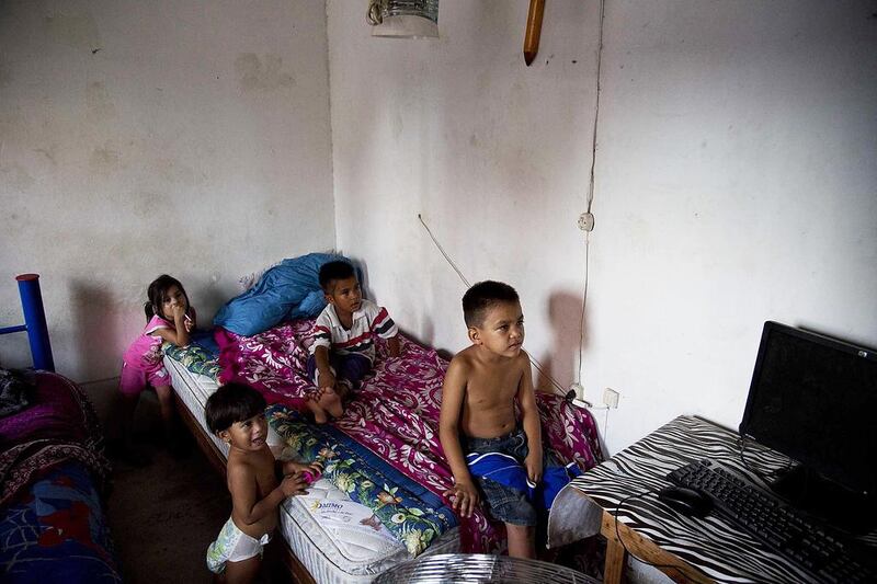 In this photo taken on July 10, 2014, children are watching television at the “Todo por Ellos” shelter for migrant children in Tapachula, Mexico. Eduardo Verdugo/AP Photo
