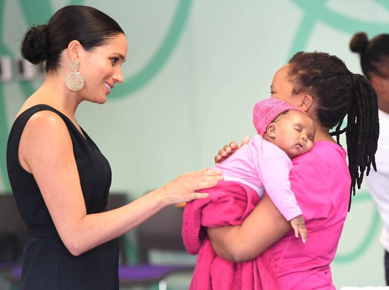 The duchess chats to a mother at M2M. EPA