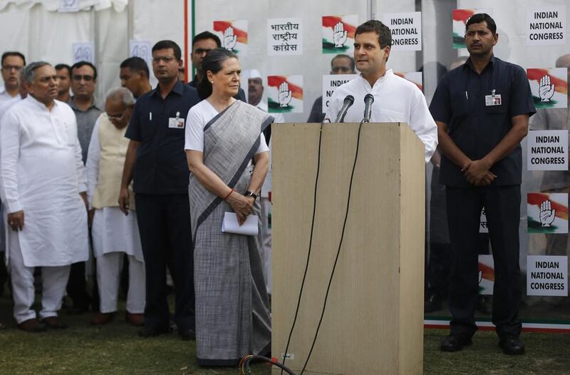 Rahul Gandhi addresses the media, as his mother and the Congress party president Sonia Gandhi stands by his side outside the party headquarters in New  Delhi. “I wish the new government all the best,” Mr Gandhi said. Altaf Qadri / AP Photo / May 16, 2014