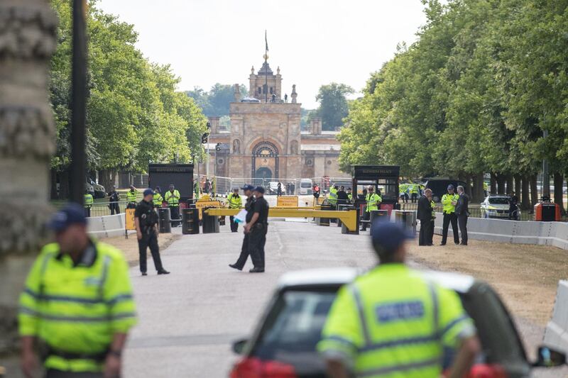 Protesters gather at the gates of Blenheim Palace. Getty Images