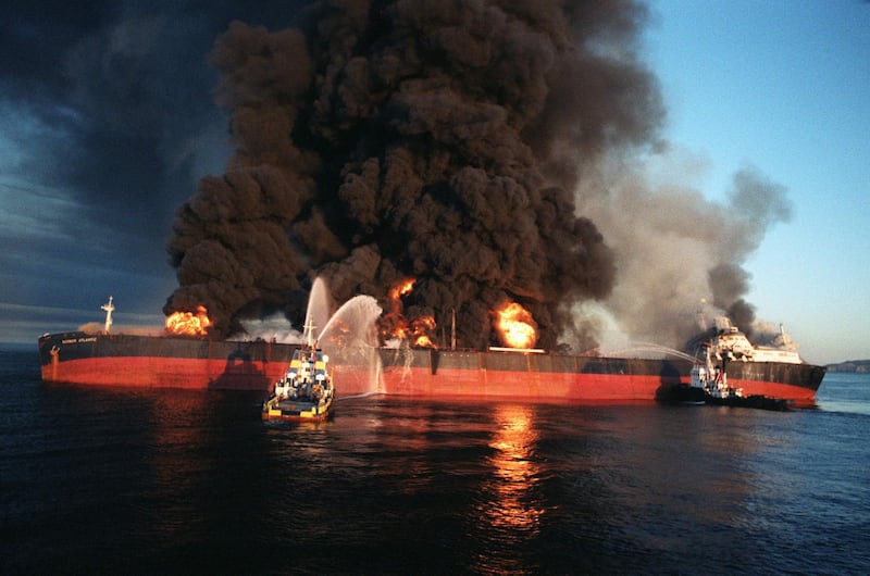 Firefighting vessels on the Singapore-flagged tanker Norman Atlantic after an Iranian attack near the Strait of Hormuz on December 6, 1987. AFP