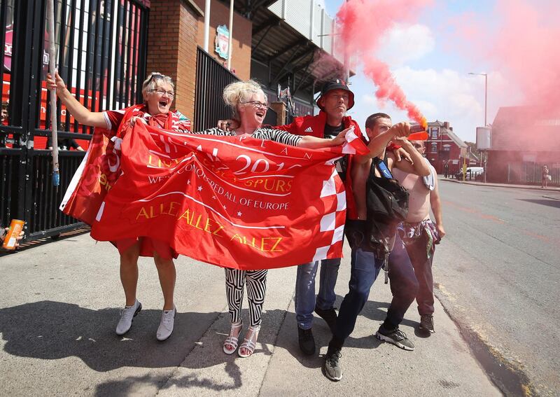 Liverpool fans celebrate outside Anfield on Friday, the second day of partying. PA