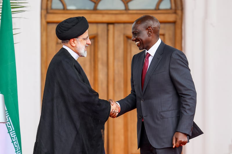 Kenyan President William Ruto, right, shakes hand with Mr Raisi at the Statehouse in Nairobi, Kenya, on July 12, 2023. EPA 