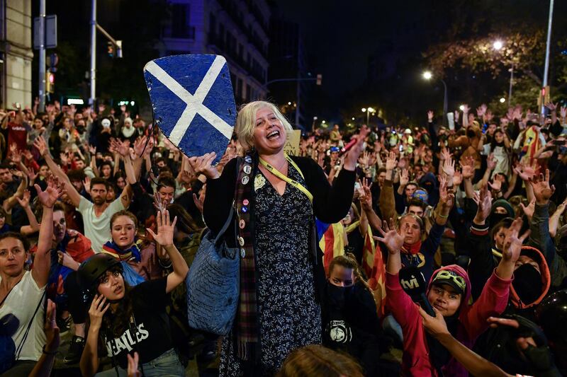 Laura Marshall from Edinburgh, addresses demonstrators as they gathered this evening following a week of protests over the jail sentences given to separatist politicians by Spains Supreme Court in Barcelona, Spain. Getty Images