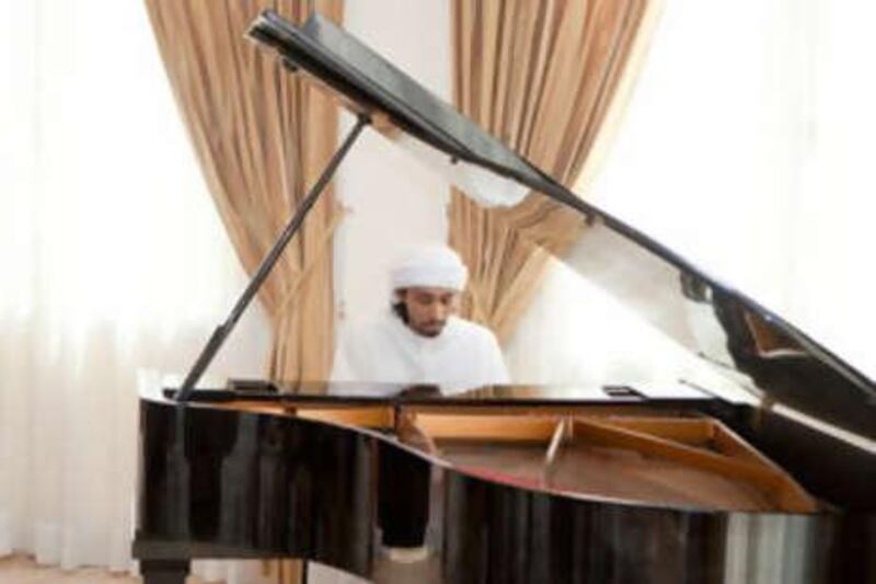 Ibrahim al Junaibi plays during the concert.