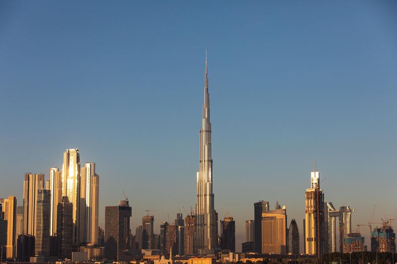 The Burj Khalifa skyscraper, center, stands above other skyscrapers on the city skyline in Dubai, United Arab Emirates, on Tuesday, Dec. 24, 2019. Dubai’s spending will surge next year as it prepares for World Expo 2020, according to the budget the government approved on Sunday. Photographer: Christopher Pike/Bloomberg