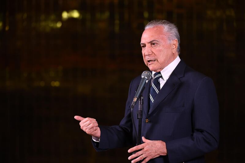 Brazil's outgoing president Michel Temer delivers a speech in Brasilia after official results gave Mr Bolsonaro 55.7 percent of the vote of the presidential run-off election. AFP