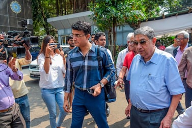 Ex-India captain Sourav Ganguly, centre, and former BCCI president N. Srinivasan at the BCCI headquarters at the Wankhede Stadium to file nomination for the board's elections. AFP