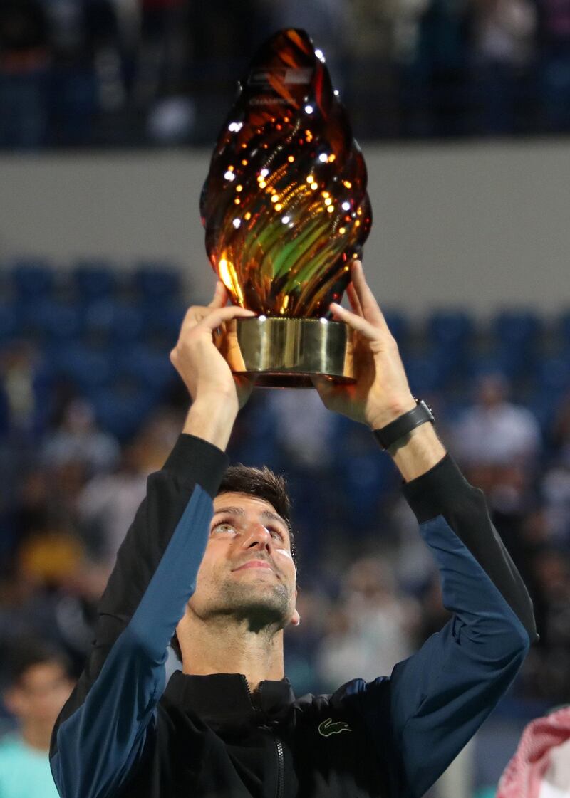 Novak Djokovic, who holds aloft the trophy in Abu Dhabi, will now be an even stronger contender at the Australian Open next year. Suhaib Salem / Reuters