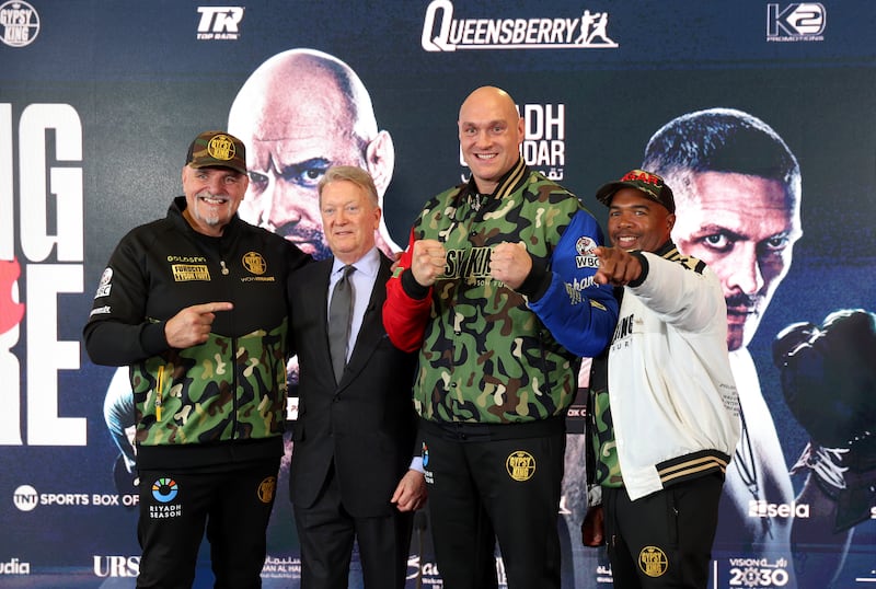 From the left: Father of Tyson Fury, John Fury, promoter Frank Warren, Tyson Fury and trainer SugarHill Steward. Getty Images
