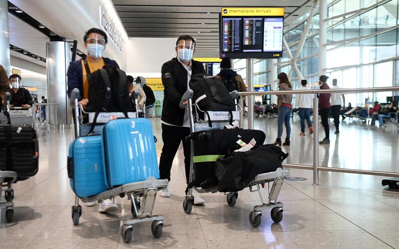 Travellers arrive at Heathrow Airport in London. Holidays abroad are set to resume on 17 May if the governments road map for lockdown easing continues. EPA