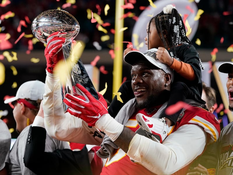 Chiefs' Frank Clark celebrates with the Vince Lombardi trophy. Reuters