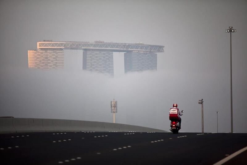 Thick fog moves across Reem Island in Abu Dhabi on January 28, 2013. Silvia Razgova / The National