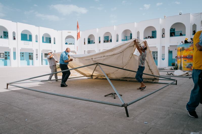 Volunteers from organisations including the Red Crescent and the Tunisian Scouts came together to keep vaccine centres running smoothly.