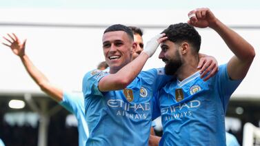 Manchester City's Josko Gvardiol, right, celebrates after scoring his side's third goal during the English Premier League soccer match between Fulham and Manchester City at the Craven Cottage Stadium in London, Saturday, May 11, 2024.  (AP Photo / Kirsty Wigglesworth)