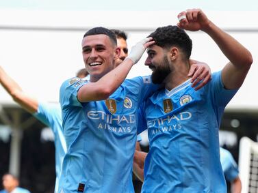 Manchester City's Josko Gvardiol, right, celebrates after scoring his side's third goal during the English Premier League soccer match between Fulham and Manchester City at the Craven Cottage Stadium in London, Saturday, May 11, 2024.  (AP Photo / Kirsty Wigglesworth)