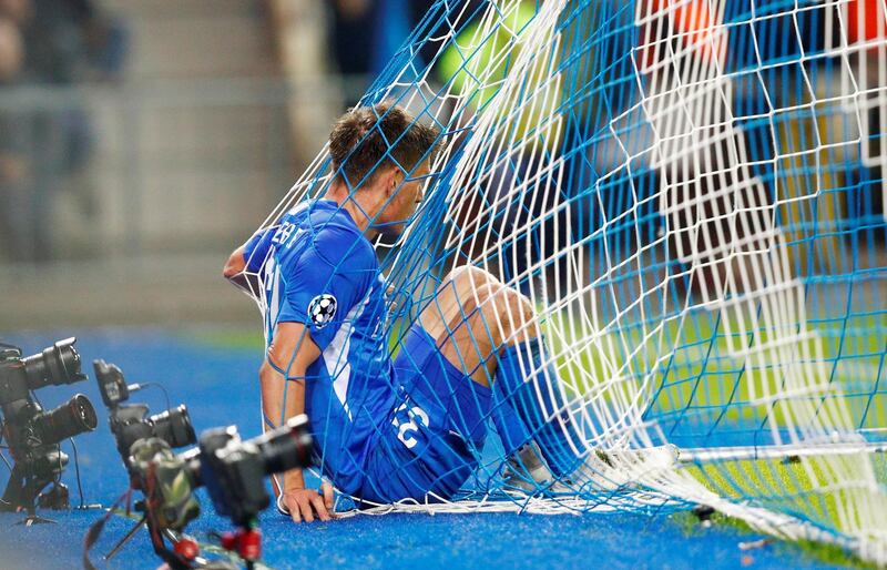 Joakim Maehle falls into the net. Reuters