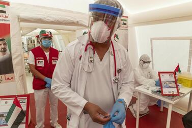 A doctor awaits patients at a field hospital set up in Ajman. Antonie Robertson / The National  