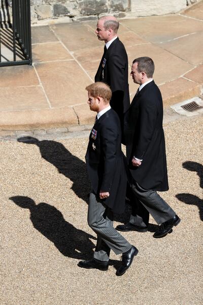 Britain's Prince William, Duke of Cambridge and Prince Harry, Duke of Sussex walk behind the hearse on the grounds of Windsor Castle during the funeral of Britain's Prince Philip, husband of Queen Elizabeth, who died at the age of 99, in Windsor, Britain, April 17, 2021. Adrian Dennis/Pool via REUTERS