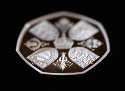 The reverse of a 50p coin featuring the four quarters of the Royal Arms and the home nation emblems. Bloomberg