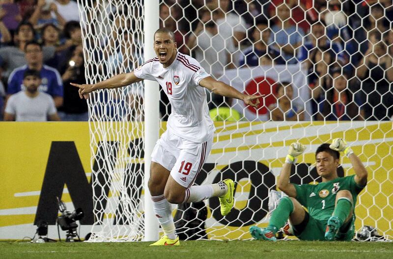 UAE's Ismail Ahmed (L) celebrates his match winning penalty kick as Japan's goalkeeper Eiji Kawashima reacts during the penalty shoot out in their Asian Cup quarter-final soccer match at the Stadium Australia in Sydney January 23, 2015. REUTERS/Jason Reed (AUSTRALIA  - Tags: SPORT SOCCER TPX IMAGES OF THE DAY)   - SR1EB1N0ZX6RW