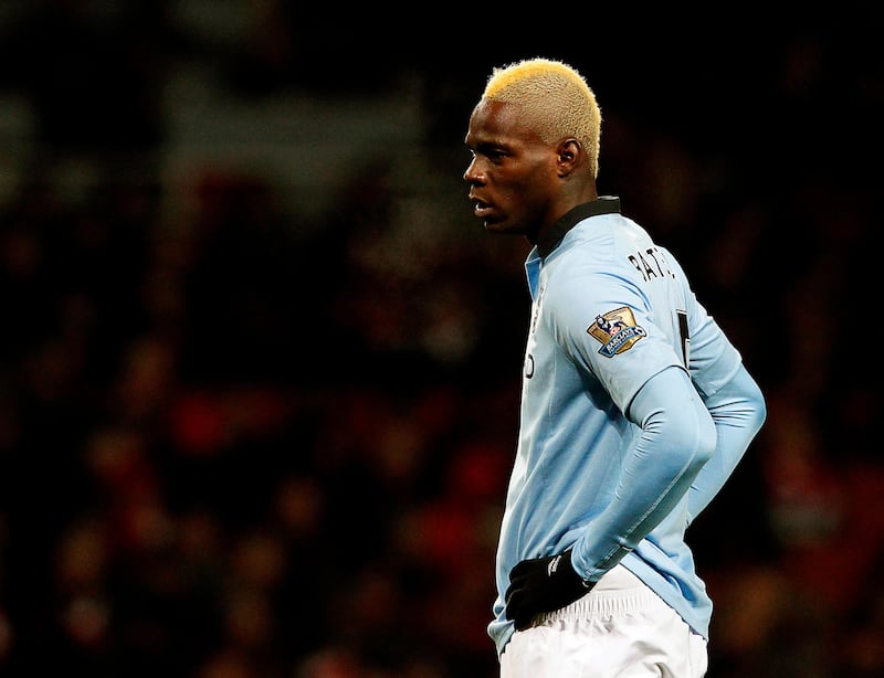 epa03560699 (FILE) A file photo dated 13 January 2013 shows Mario Balotelli of Manchester City, during the English Premier League soccer match between Arsenal and Manchester City at the Emirates Stadium, London, Britain. According to British news sources on 29 January 2013, AC Milan agreed with Manchester City to sign with Mario Balotelli.  EPA/KERIM OKTEN *** Local Caption ***  03560699.jpg