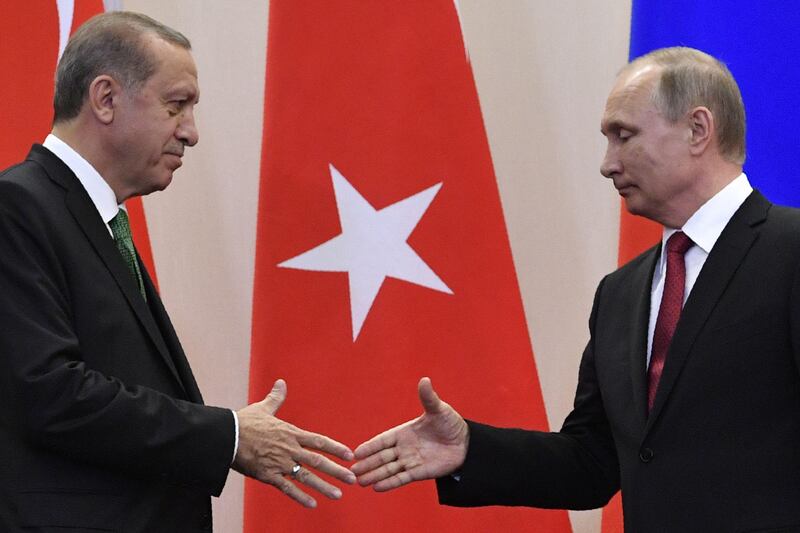 (FILES) This file photo taken on May 03, 2017 shows Russian President Vladimir Putin (R) shaking hands with his Turkish counterpart Recep Tayyip Erdogan after a joint press conference following their meeting at the Bocharov Ruchei state residence in Sochi.
Turkey and Russia are inching towards an accord for the first major Turkish weapons purchase from Moscow, troubling Ankara's allies in NATO even though the deal may not ultimately materialise. / AFP PHOTO / Alexander NEMENOV