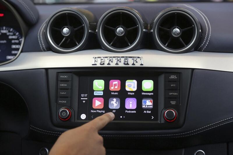 Apple’s Stephen Chick displays the CarPlay program at the Worldwide Developers Conference in San Francisco. Robert Galbraith / Reuters