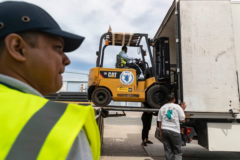UN aid is loaded on to lorries in Dubai before being taken to Jordan, where the supplies will be kept until they can be moved into Gaza. Antonie Robertson / The National