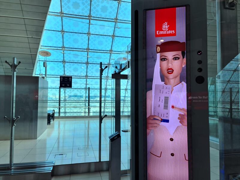 This picture taken on March 7, 2021 shows a newly deployed fast-track gate that uses face and iris-recognition technologies at Dubai international airport.  The new biometric system has been deployed at 122 smart gates at arrival and departure terminals for first class passengers.  / AFP / Mohamad Ali Harissi
