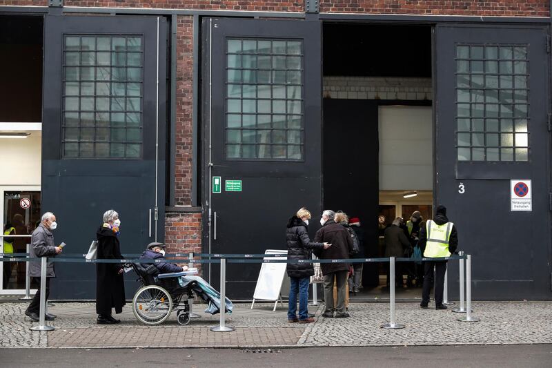 People queue at a vaccination center in the Arena event hall in Berlin, Germany. EPA