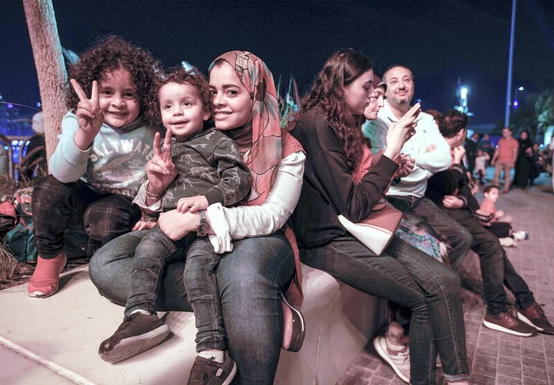 Abu Dhabi, United Arab Emirates, December 31, 2019.  The Ahmad family awaits the NYE fireworks at Galleria Mall, Al Maryah Island.  
Victor Besa / The National
Section:  NA
Reporter:  Saeed Saeed
