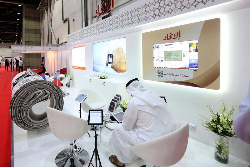 Above, the Al Ittihad stand at the three-day Smart Government Exhibition and Conference at the Dubai World Trade Centre. Satish Kumar / The National