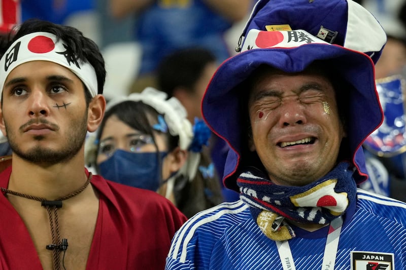 Fans of Japan show their emotions after their defeat to Croatia. AP Photo