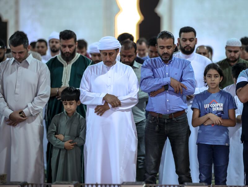 Isha prayers at the Sheikh Zayed Grand Mosque in Abu Dhabi. Victor Besa / The National