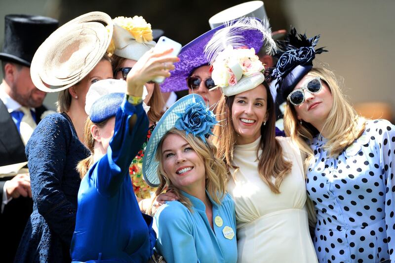 Autumn poses for a picture with racegoers. Mike Egerton / PA Wire