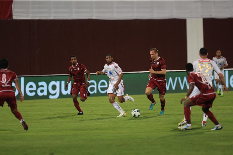 Al Wahda's Srdan Andric dribbles the ball through Al Jazira defenders during the semi-Final Pro League football match between Al Wahda v Al Jazira (white) at Al Wahda's (red) at Al Nahyan Stadium in Abu Dhabi on Monday March 25, 2013. (Ravindranath K / The National)?