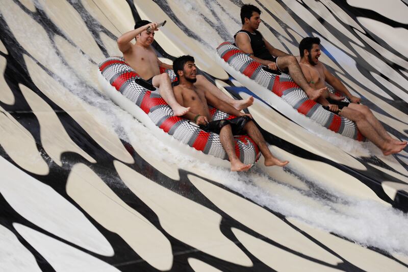 Daytrippers on a water slide at the Aqua Park in Baghdad.