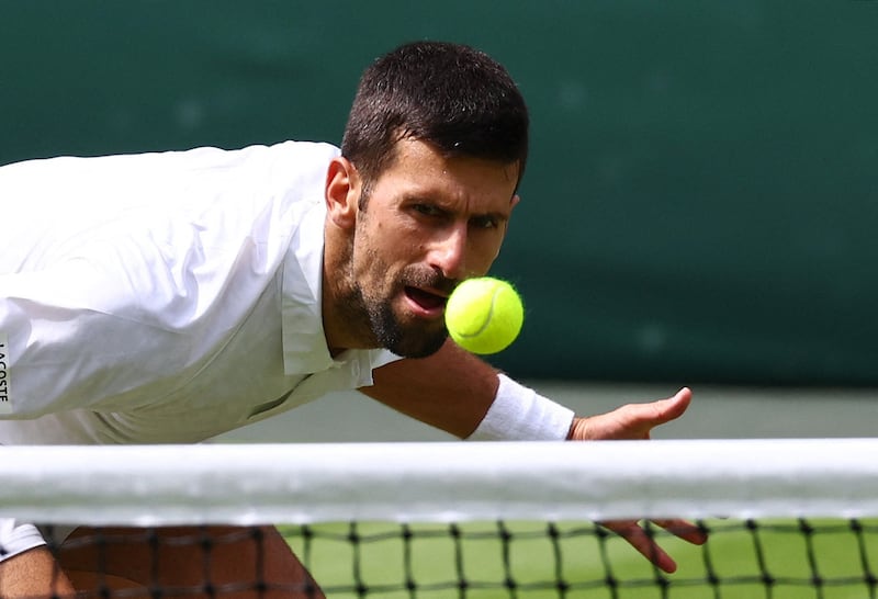 Serbia's Novak Djokovic in action at the net. Reuters