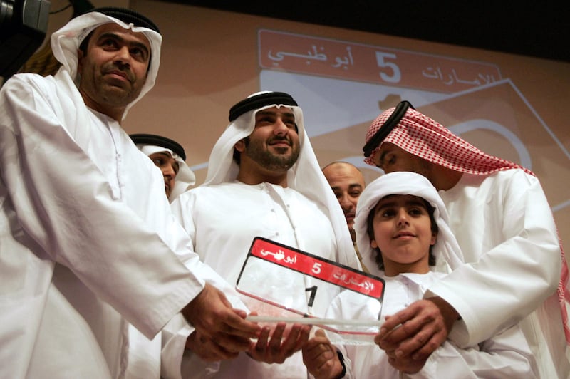 Saeed Al Khouri with the most expensive car number plate – at the time – which he bought in an auction in Abu Dhabi in 2008. Photo: AFP