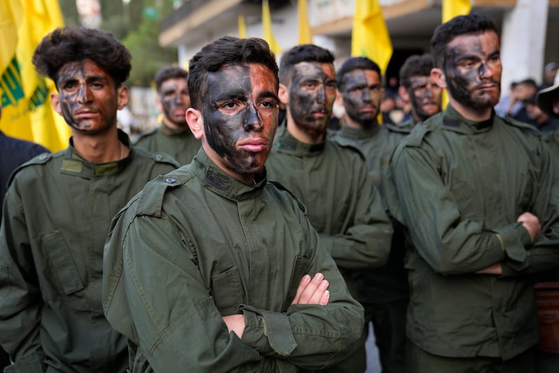 Hezbollah fighters attend the funeral procession of two comrades in Kherbet Selem, south Lebanon. AP Photo