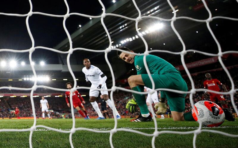 Liverpool's Mohamed Salah scores their second goal past West Ham United's Lukasz Fabianski. Reuters