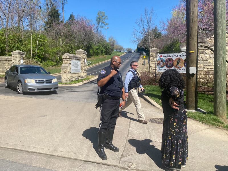 Metro Nashville Police officers block the entrance to the school. The Tennessean via AP