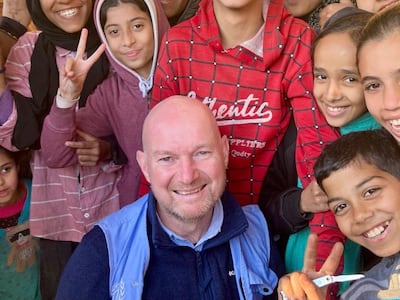 John Whyte with children at the Maasna Designated Emergency Shelter in Deir Al Balah. On February 5, at least seven people were killed in an Israeli air strike there. Photo: John Whyte