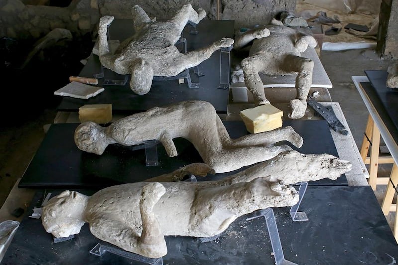 Plaster cast moulds of victims of the Mount Vesuvius eruption lie on a display table in a laboratory at Pompeii. Alessandro Bianchi / Reuters