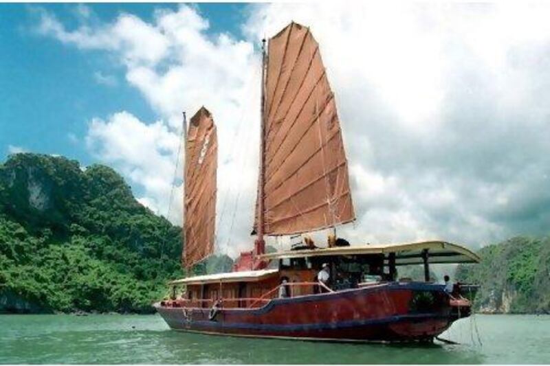 Sail around Halong Bay in a junk - one of the many activities included in Explore's "family adventure" trips to Vietnam this summer. AFP