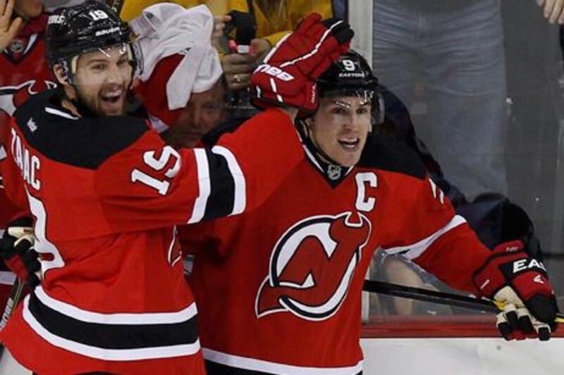 New Jersey Devils' Zach Parise (R) celebrates with teammate Travis Zajac after scoring on the New York Rangers during the third period in Game 4 of their NHL Eastern Conference Final hockey playoff game in Newark, New Jersey May 21, 2012.   REUTERS/Adam Hunger (UNITED STATES  - Tags: SPORT ICE HOCKEY) 
Picture Supplied by Action Images