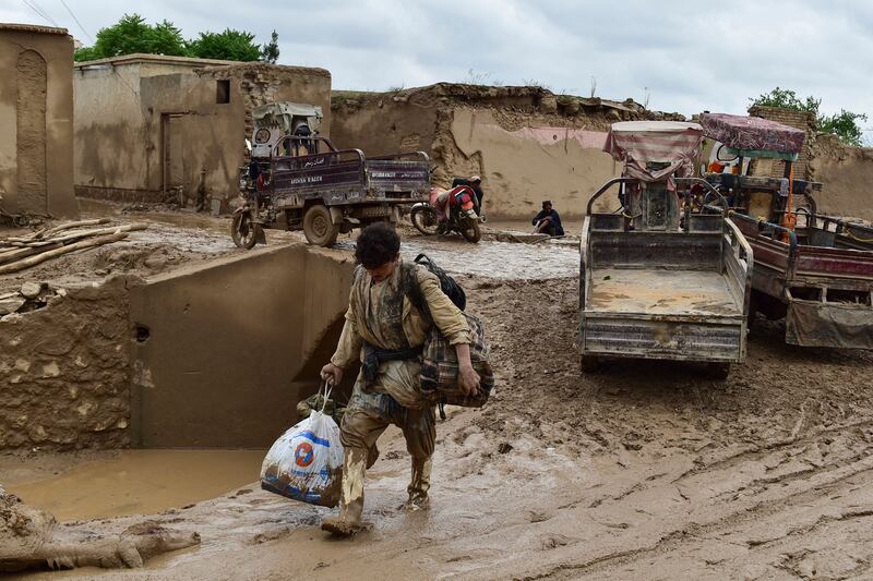 A mud-covered street in Laqiha village, Baghlani Markazi   district. AFP