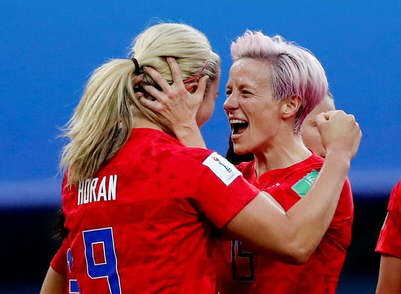 Lindsey Horan of the US celebrates scoring their third goal with Megan Rapinoe. Reuters