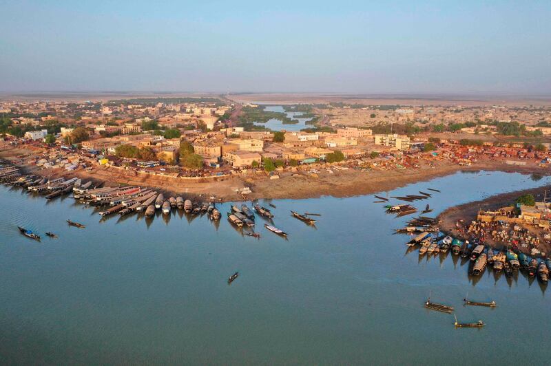 An aerial view shows the harbor of Mopti in central Mali on February 29, 2020. Two months earlier 400 Dogon people fled their village of Toou finding a shelter in a school in Sevare. AFP